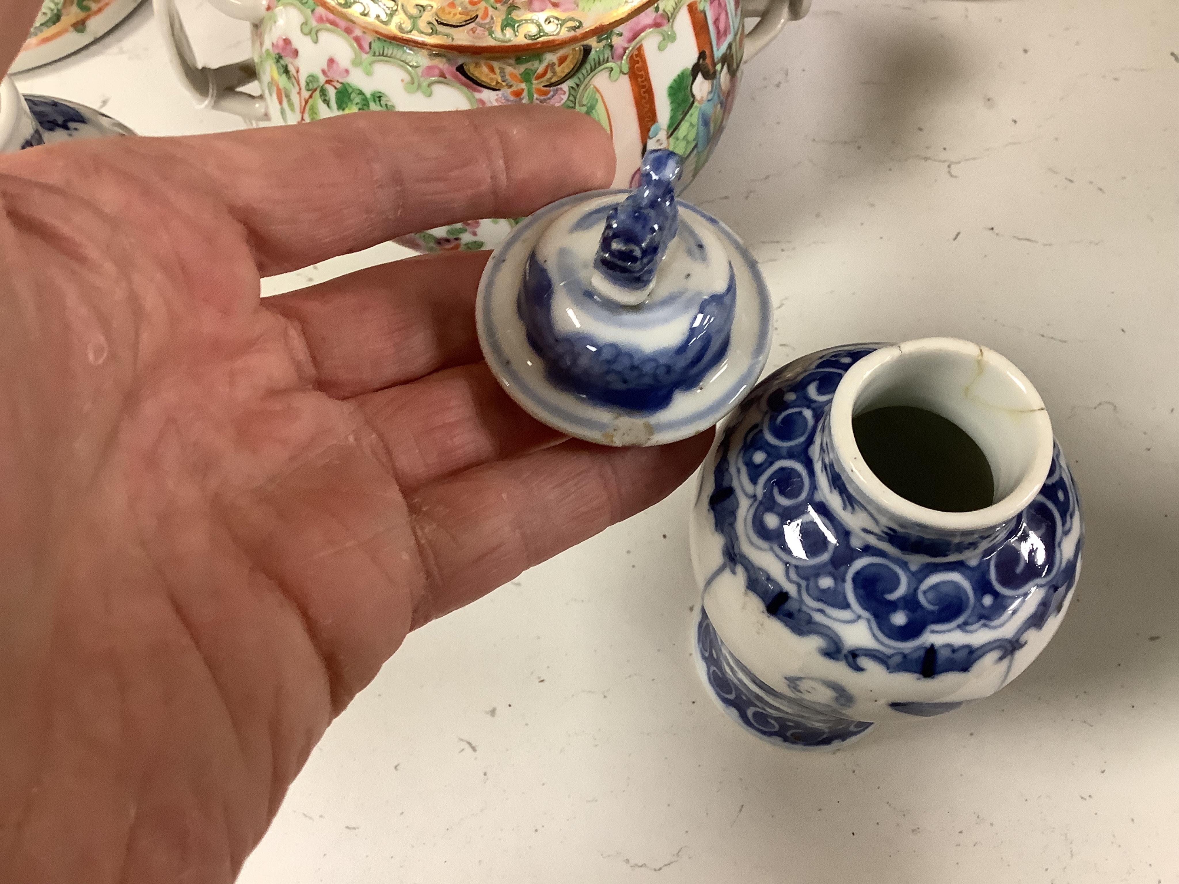 A collection of 19th century Chinese porcelain to include a pair of famille rose candlesticks, dish and a pair of blue and white baluster vases and covers